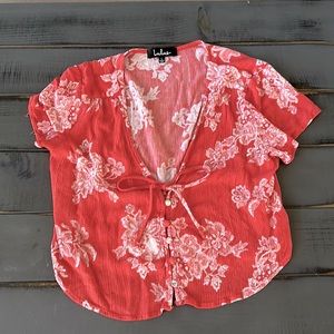 Bright orangish coral tie button blouse. Size L in woman’s.